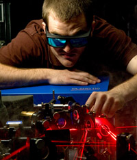 JRA student James Sayers at work on the laser table for his physics project
