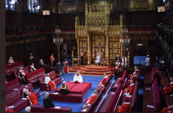 An aerial view over the House of Lords while the Queen reads the Government-scripted speech