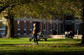 Person walking across Sussex campus