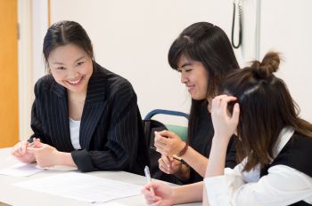 Three female students in an English Language for Academic Study session
