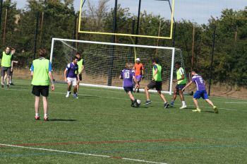 MPS charity football players in action