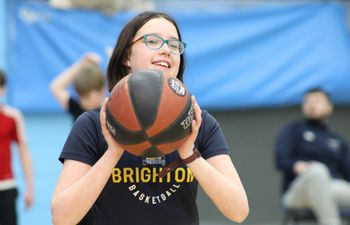 Image of young girl playing basketball