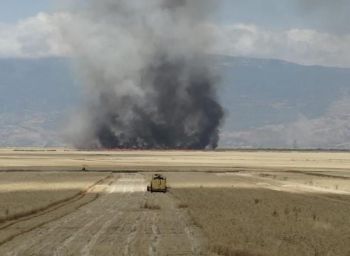 Fires to be seen during harvesting wheat fields in the Idleb Governorate