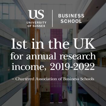 Interior of Business School with text that say 1st in UK for research income