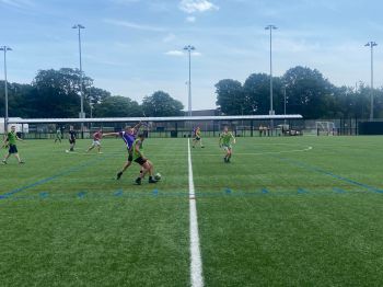 MPS charity football team players on the pitch during the game