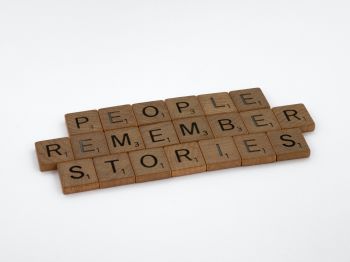 Scrabble pieces saying People remember stories