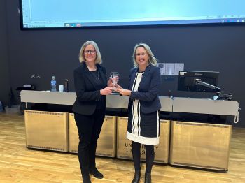 Professor Michelle West presenting Professor Rachel McKendry with the Cornforth Award