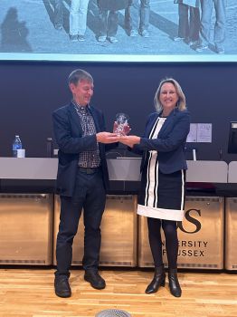 Professor Michelle West presenting Professor Philip Ingham with the Maynard Smith Award