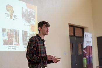 Dexter Shepherd presenting in front of a class
