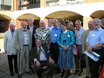Tez Quirke (standing, fourth from left), Asa Briggs (seated) and former members of the Students’ Union Executive Committee in front of Falmer House on campus