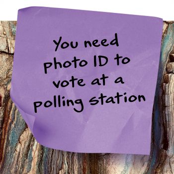 A purple post-it note that says