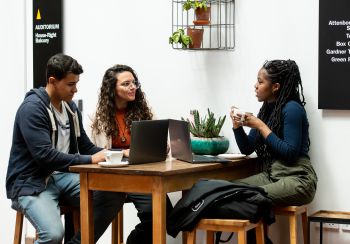 Postgraduate students share a coffee