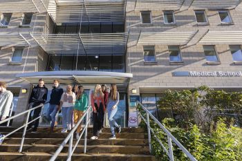 a group of BSMS students outside the teaching building on the Sussex campus