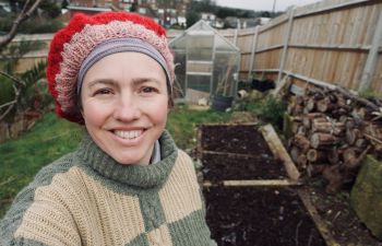 Dr Rachael Durrant standing in a garden allotment