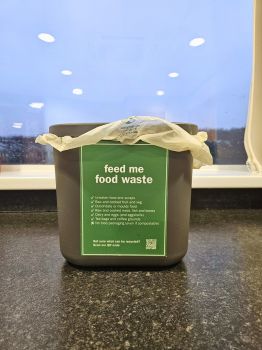 Food waste recycling caddy on a table top