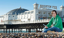 Student in front of Brighton pier
