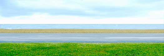 Seascape, horizontal grass, road, pebbles, sea, sky -  in the form of Andreas Gursky's Rhein II photograph