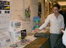 Product design student explaining his work at the show