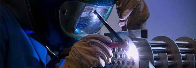 Student in workshop welding