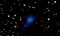 Faint red galaxies of the cluster in the centre, along with the bluish X-ray emission from the extre
