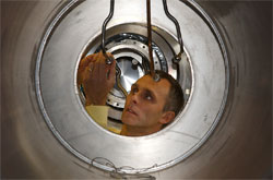 Philip Harris inspects the helium lines on the neutron EDM apparatus.