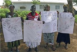 Women in Kumasi, Ghana, with their visual story maps about violence