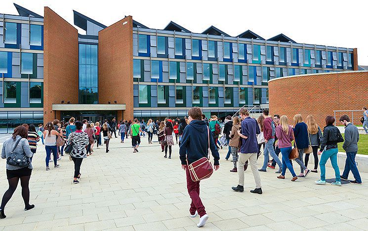 Students and staff head towards the building