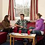Students chatting in the sitting room of Lewes Court