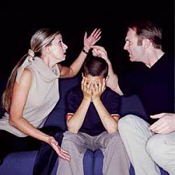 parents arguing, child sitting with head in hands.