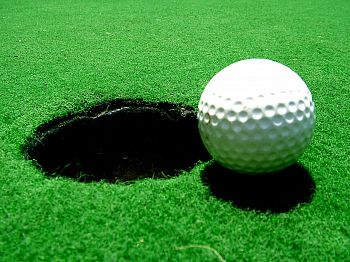 Golf ball by hole