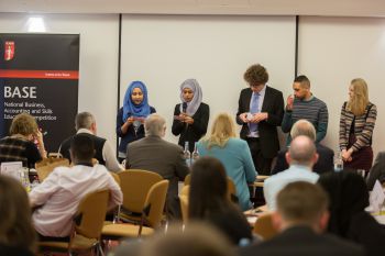 photo of team of students giving their recommendations to the judges at the ICAEW BASE competition