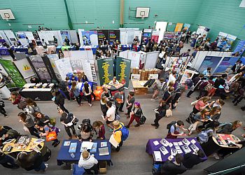 A bird's-eye view of students and exhibitors in the Sport Centre during the Sussex UCAS Convention