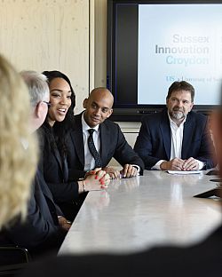 A photo showing Chuka Umunna, Mike Herd and Bianca Miller talking