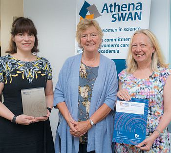 Jenny Holmes and Professor Helen Smith of BSMS receive the Athena SWAN bronze award from Professor Dame Julia Higgins.