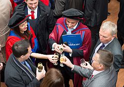 Graduates sip champagne at 2016 Winter graduation drinks reception