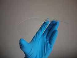 Scientist holds new more flexible material for touch-screen devices