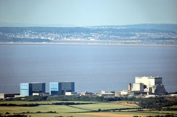 The existing Hinkley Point nuclear power station in Somerset, England. Photo by Richard Baker [CC BY-SA 2.0 (http://creativecommons.org/licenses/by-sa/2.0)], via Wikimedia Commons.
