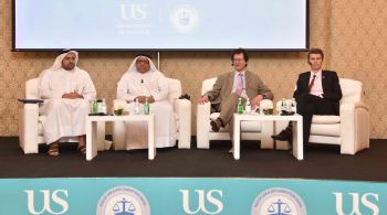 Prof Andrew Sanders (second right) and Prof Dan Hough (far right) at the launch of the LLM in Qatar.