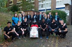 Year 10 pupils from Seaford Head school (back row) with University of Sussex students (front row) from the Sussex Racing team, who, each year, design and build a car to race at Silverstone in a global com