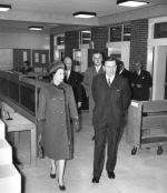 The Queen and Dennis Cox (Librarian) walk around the new Library in 1964