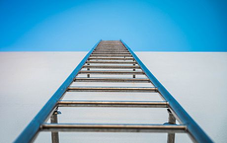 Ladder ascending into sky