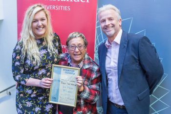 Student Molly Masters receives the £10,000 top prize from Mayor Mo Marsh and Peter Lane of SINC