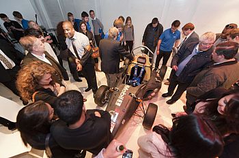 Attendees examine the car at the Formula Student launch event