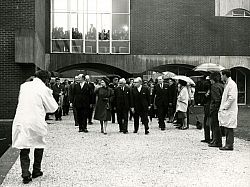 Her Majesty walking with senior members of University staff, including Vice-Chancellor John Fulton