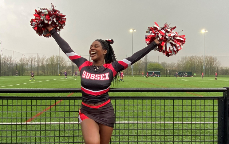 Jamila cheerleading as part of the Sussex Swallows.