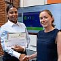 Heidi receives her certificate and cheque for winning second place in the 3MT competition