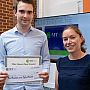 Chris receives his certificate and cheque for People's Choice Award in the 3MT competition