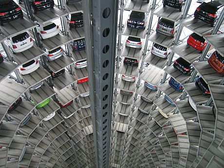 A photo of a large multi-storey car park with many cars