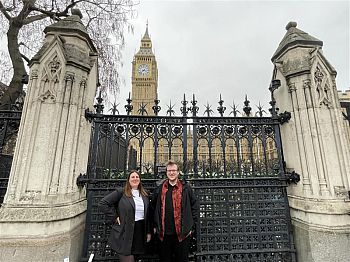 Tom Baird-Taylor and Natalia James outside the Houses of Parliament at PIP 2024