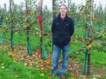 Nick Balfour in an orchard